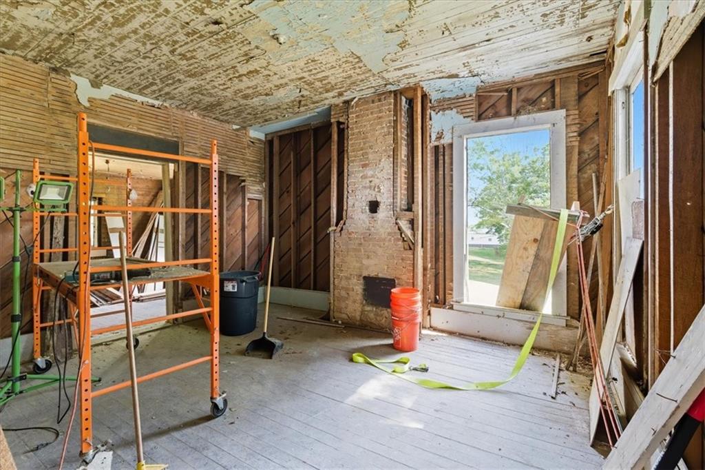 111 Bryan Street West Bremen, GA 30110 - Photo 27 of 32 a room with gym equipment wooden floor and window