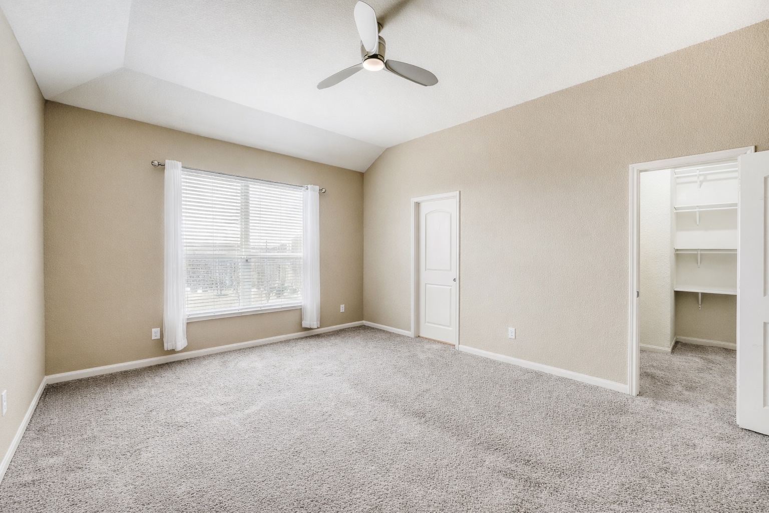 19621 Woodrow Wilson Street Manor, TX 78653 - Photo 13 of 34 an empty room with a empty space and windows