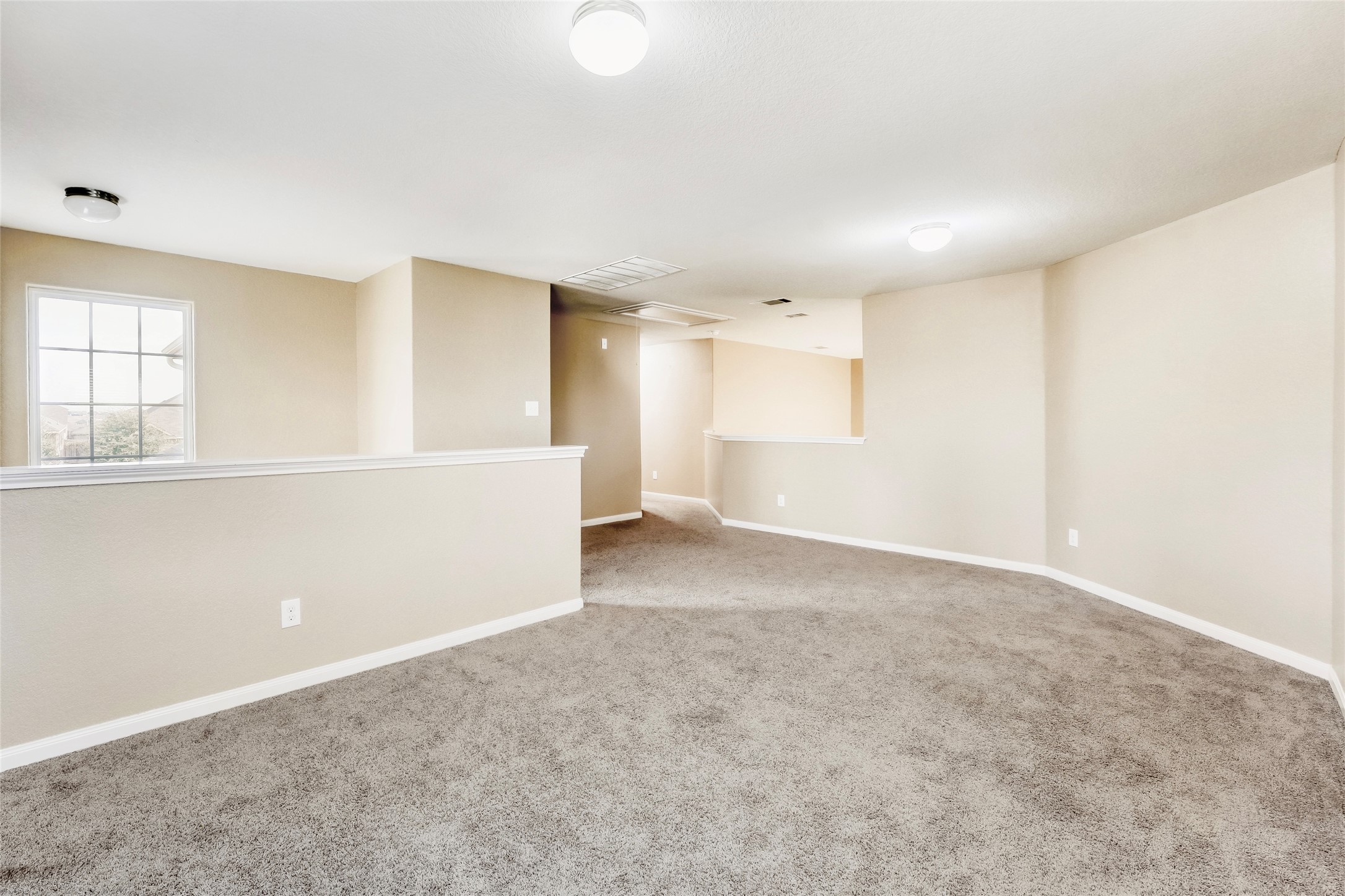 19621 Woodrow Wilson Street Manor, TX 78653 - Photo 18 of 34 a view of an empty room with a window