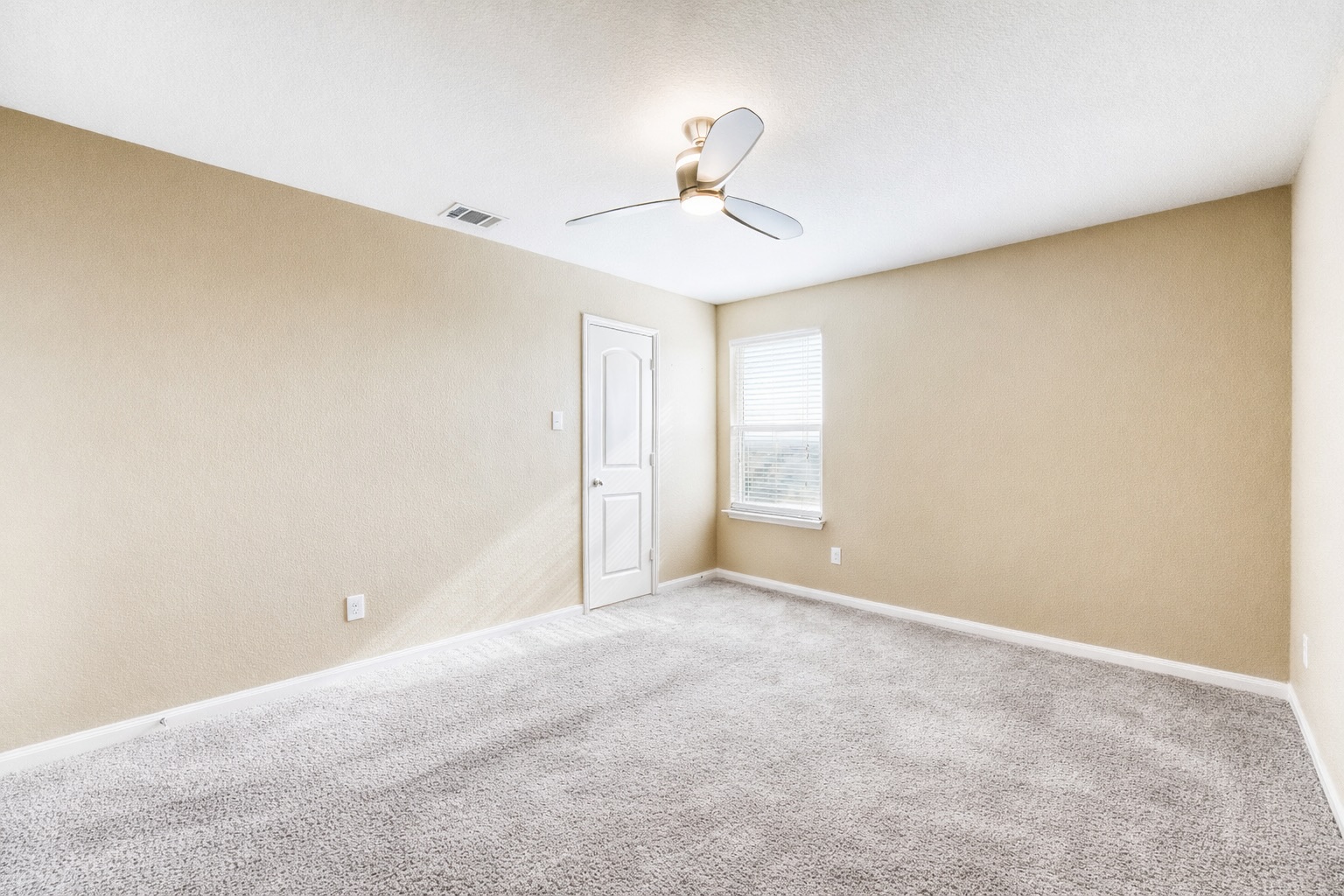 19621 Woodrow Wilson Street Manor, TX 78653 - Photo 24 of 34 a view of an empty room with a window