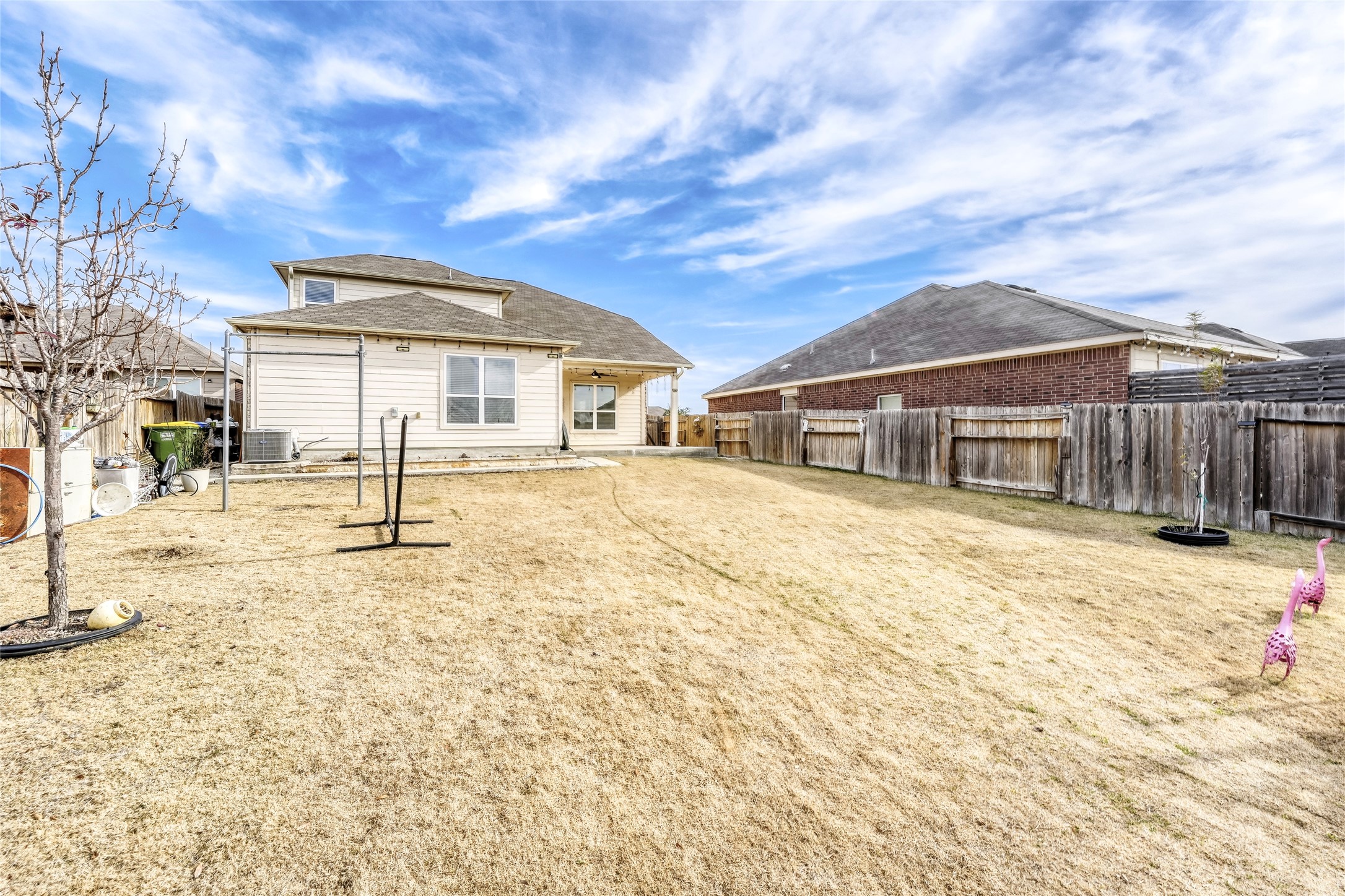 19621 Woodrow Wilson Street Manor, TX 78653 - Photo 27 of 34 a front view of a house with a yard