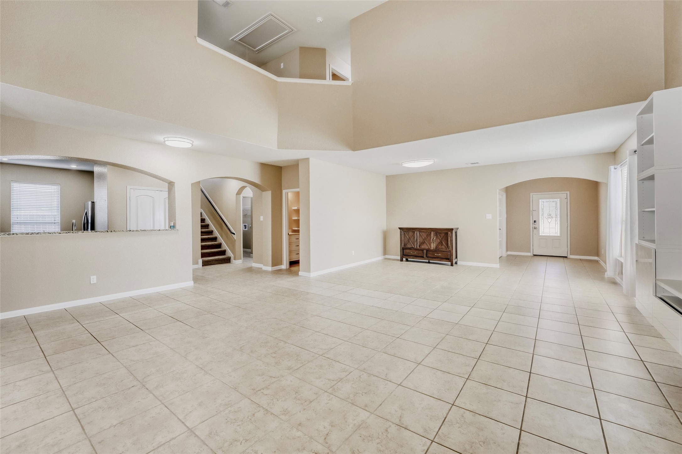 19621 Woodrow Wilson Street Manor, TX 78653 - Photo 7 of 34 a view of a livingroom with a staircase