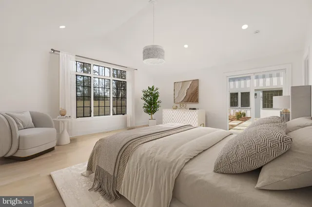 a bedroom with a bed and glass window
