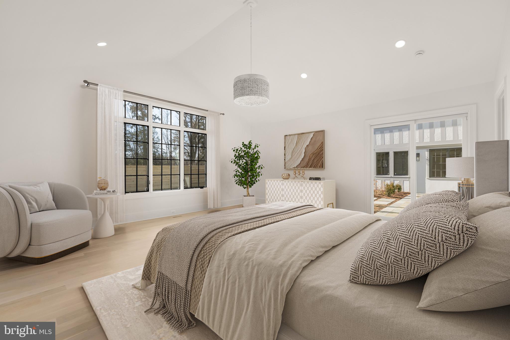 7611 Fairfax Road Bethesda, MD 20814 - Photo 17 of 44 a bedroom with a bed and glass window