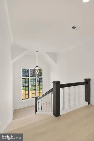 a view of an empty room with windows