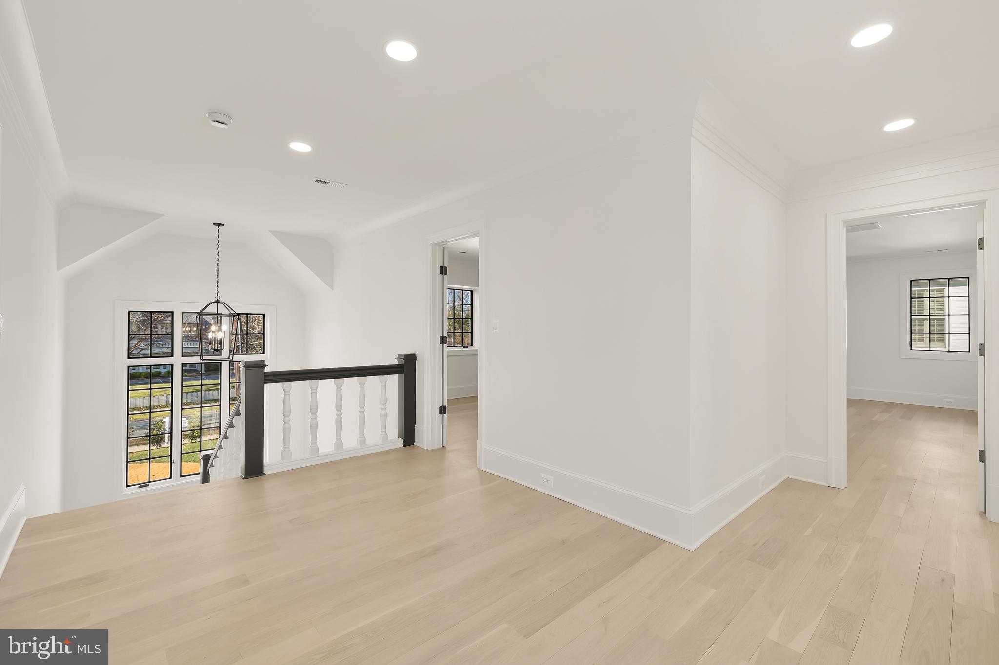 7611 Fairfax Road Bethesda, MD 20814 - Photo 22 of 44 a view of empty room with wooden floor and windows