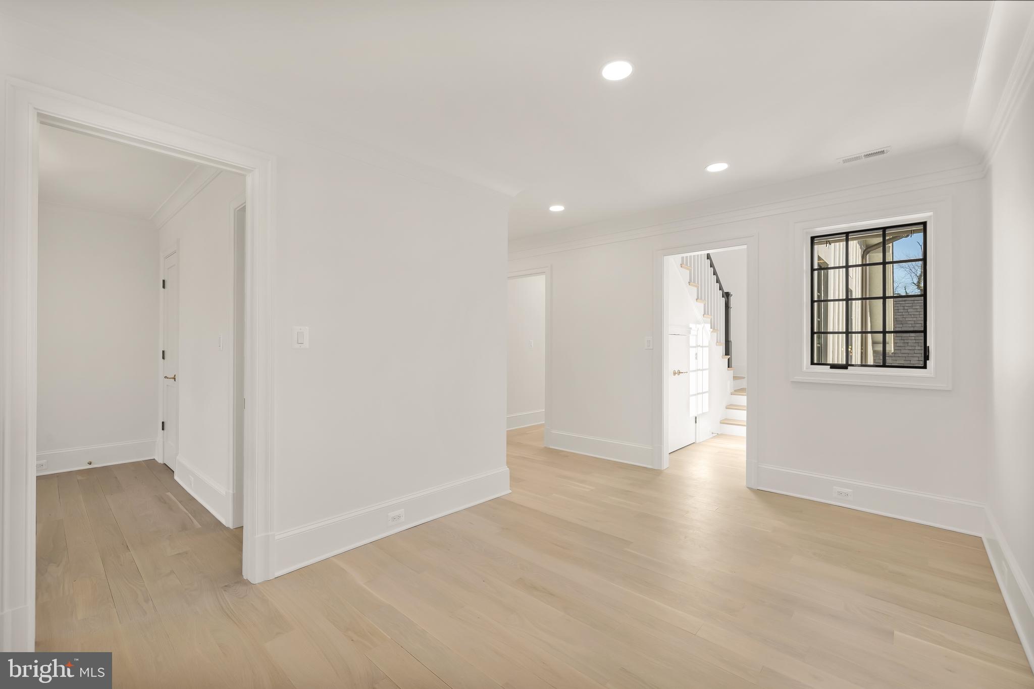 7611 Fairfax Road Bethesda, MD 20814 - Photo 28 of 44 an empty room with wooden floor and windows