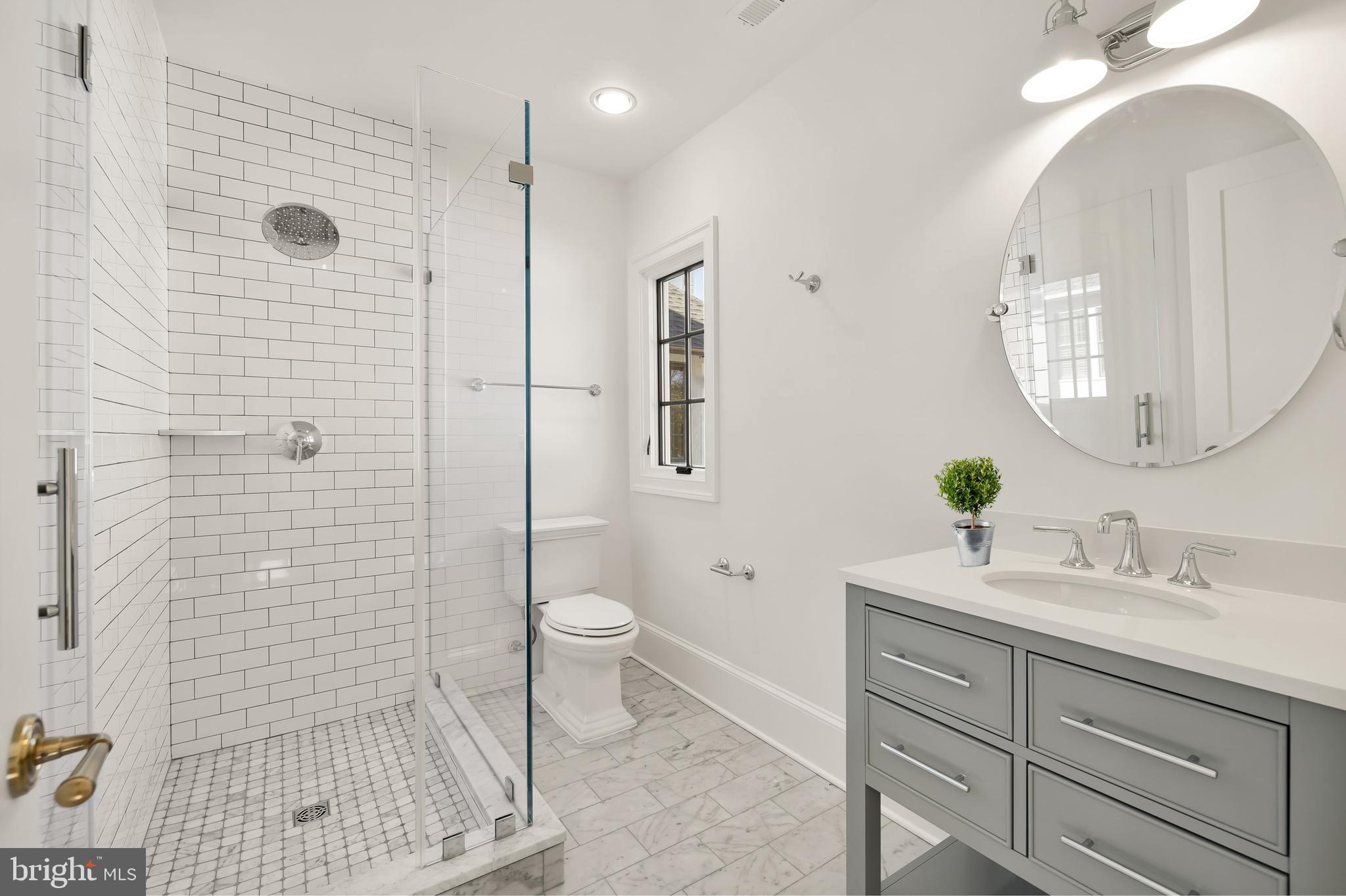 7611 Fairfax Road Bethesda, MD 20814 - Photo 33 of 44 a bathroom with a sink a toilet and shower