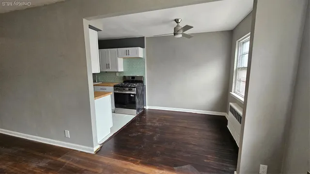 a view of a kitchen from the hallway