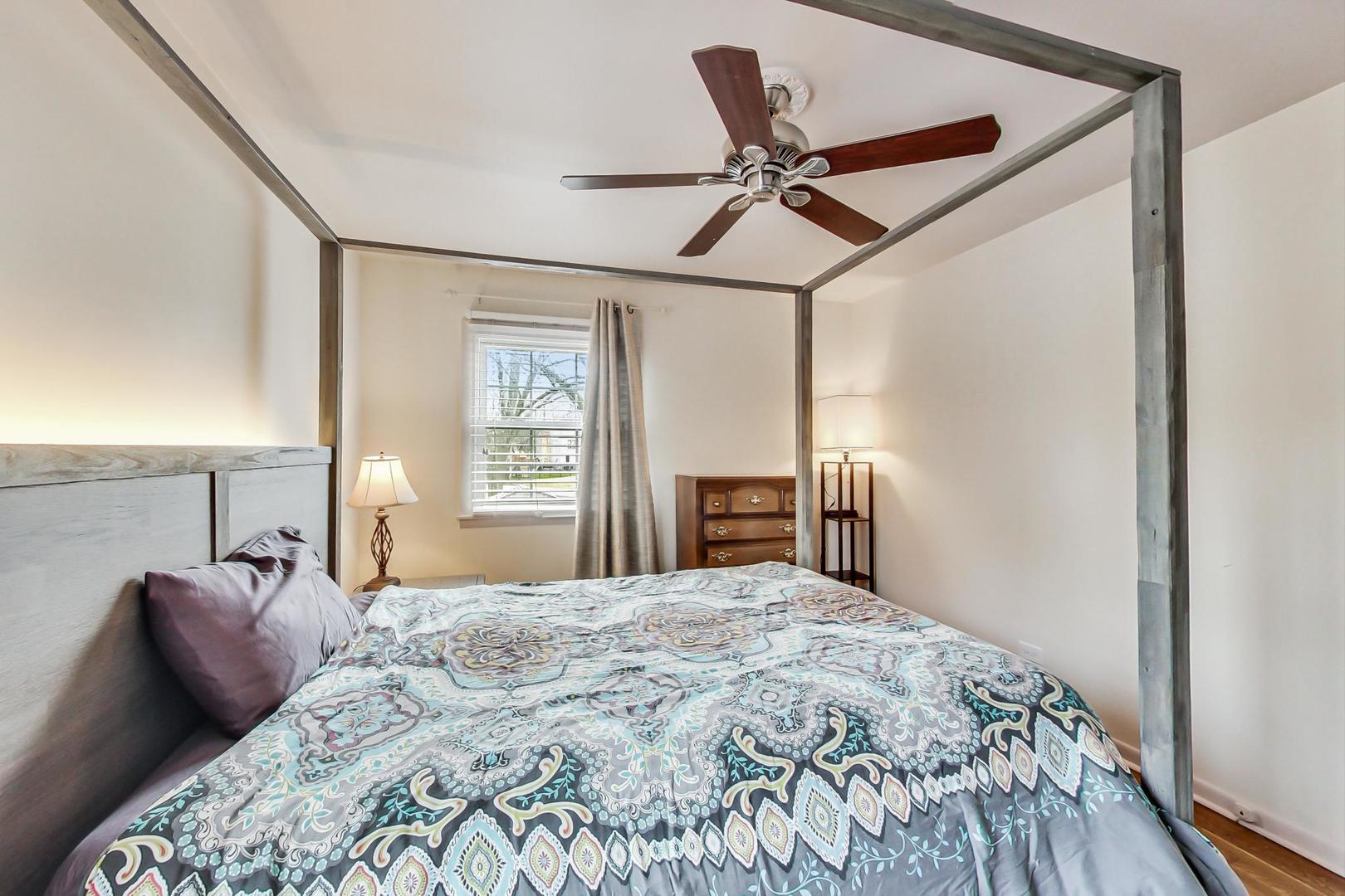 N369 Calvin Court Winfield, IL 60190 - Photo 13 of 41 a bedroom with a large bed and a window