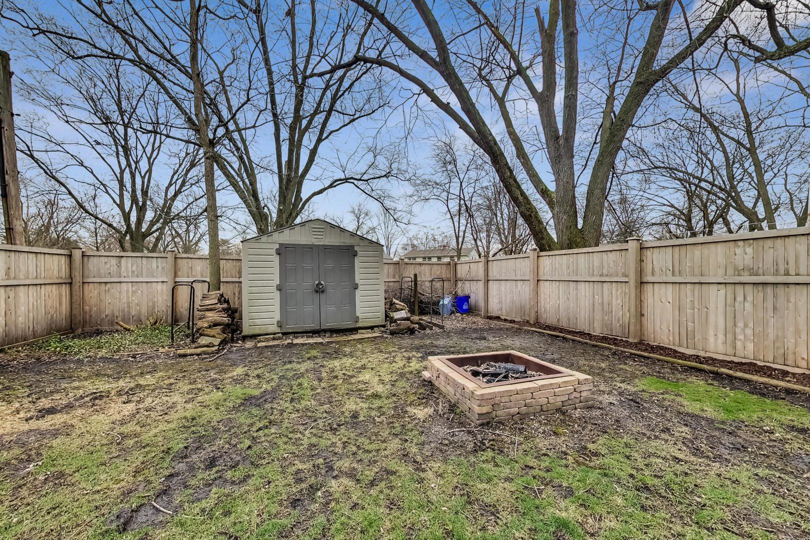N369 Calvin Court Winfield, IL 60190 - Photo 38 of 41 a backyard of a house with trampoline