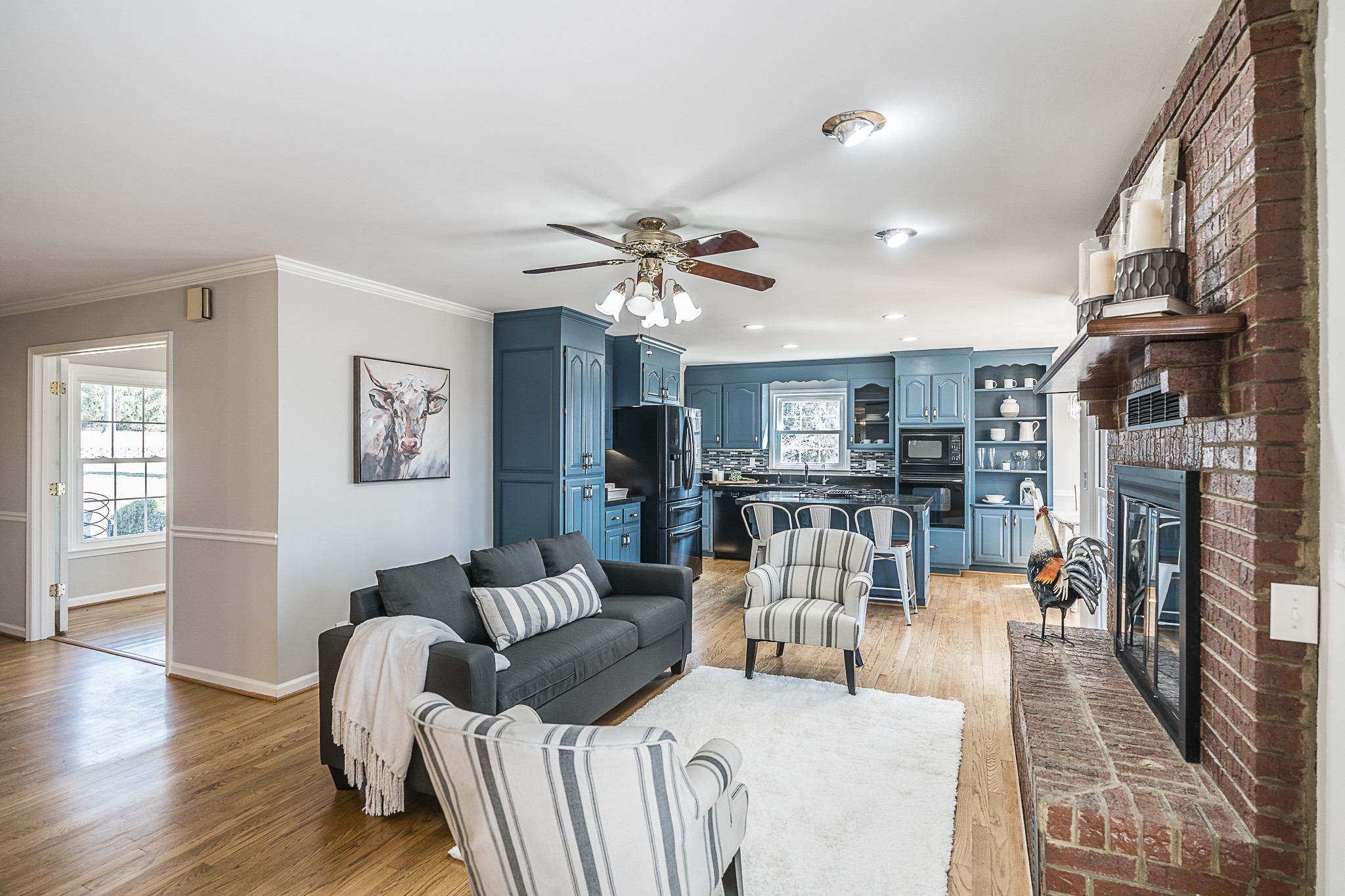 1626 Valley View Road Goodlettsville, TN 37072 - Photo 14 of 70 a living room with furniture a fireplace and a chandelier