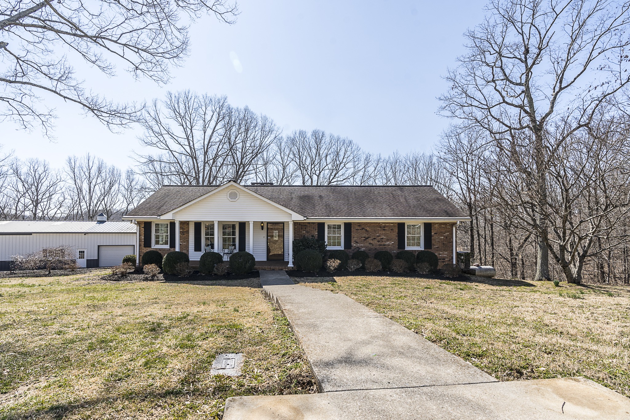1626 Valley View Road Goodlettsville, TN 37072 - Photo 3 of 70 a front view of a house with a yard covered in snow