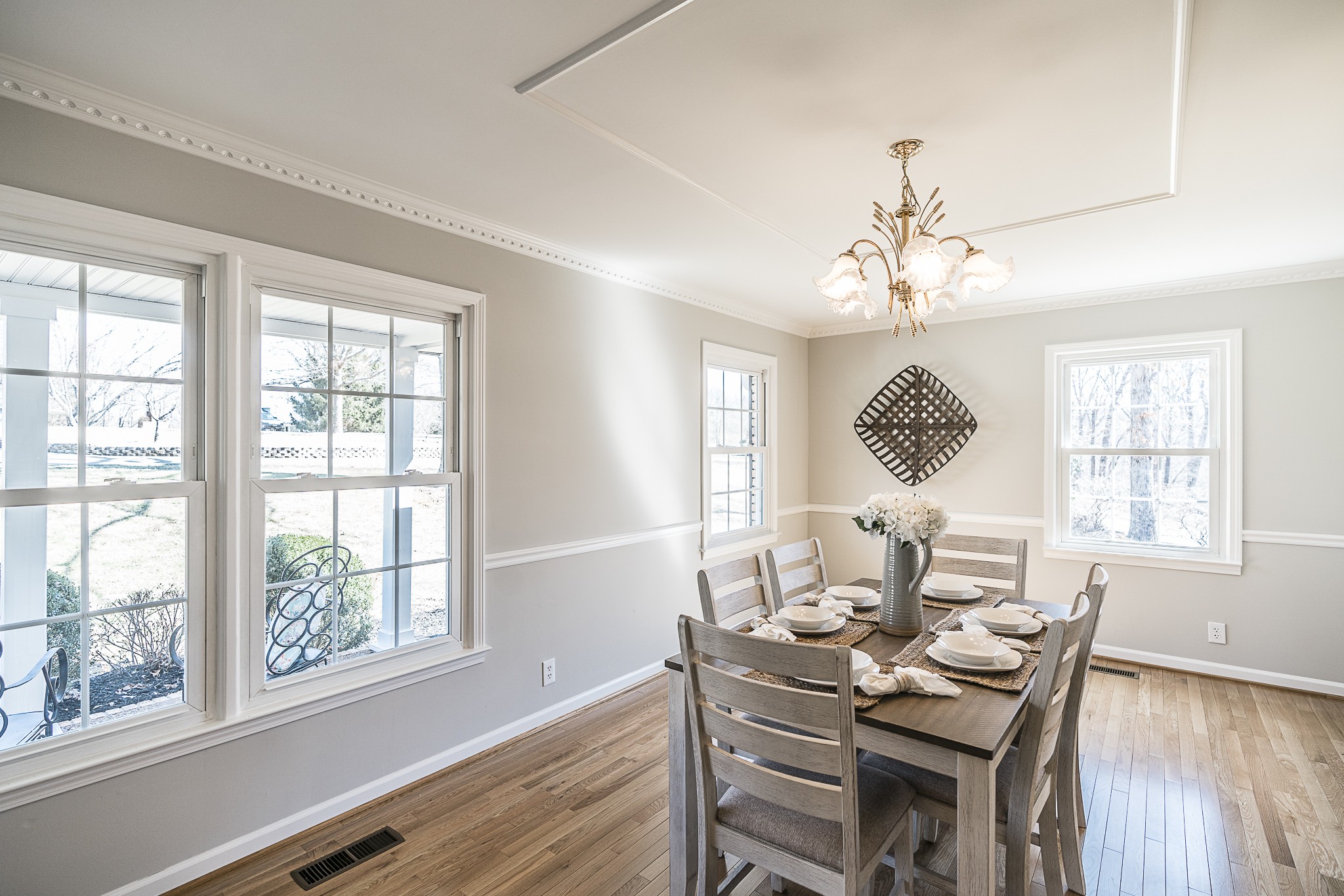 1626 Valley View Road Goodlettsville, TN 37072 - Photo 10 of 70 a dining room with wooden floor a chandelier a wooden table and chairs