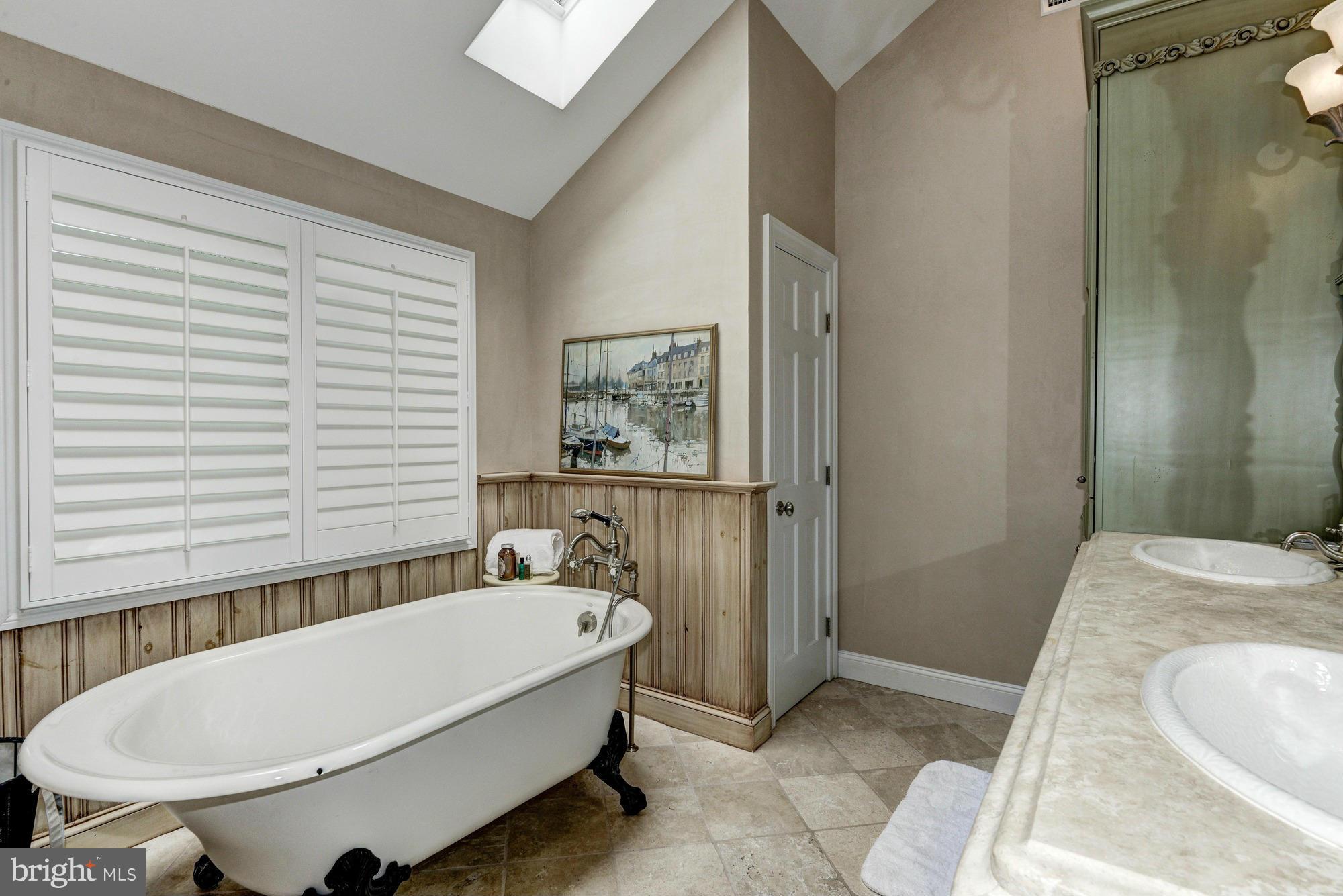 532 Sunset Road Annapolis, MD 21403 - Photo 15 of 30 a bathroom with a tub and a sink