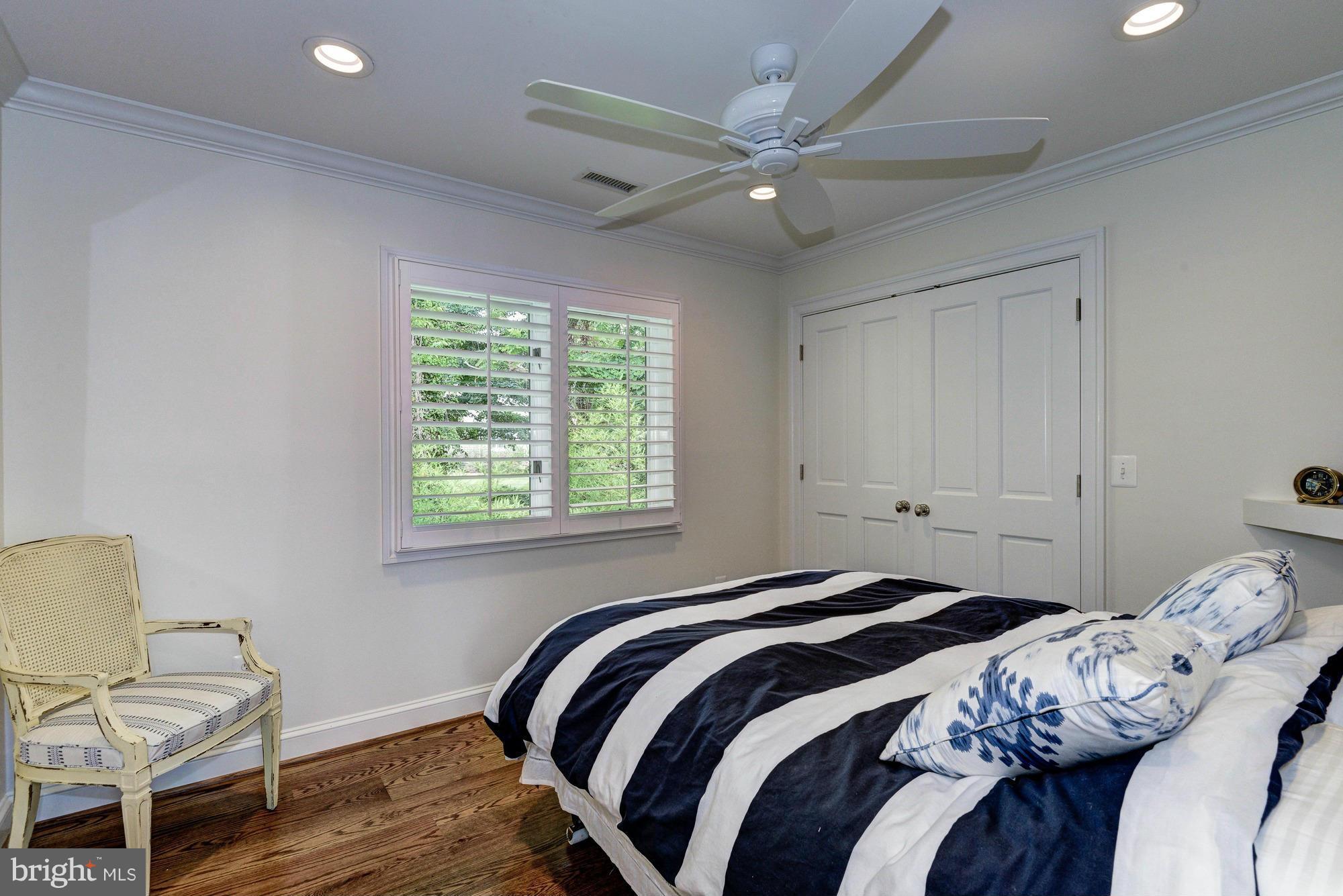 532 Sunset Road Annapolis, MD 21403 - Photo 16 of 30 a bedroom with a bed and a chair