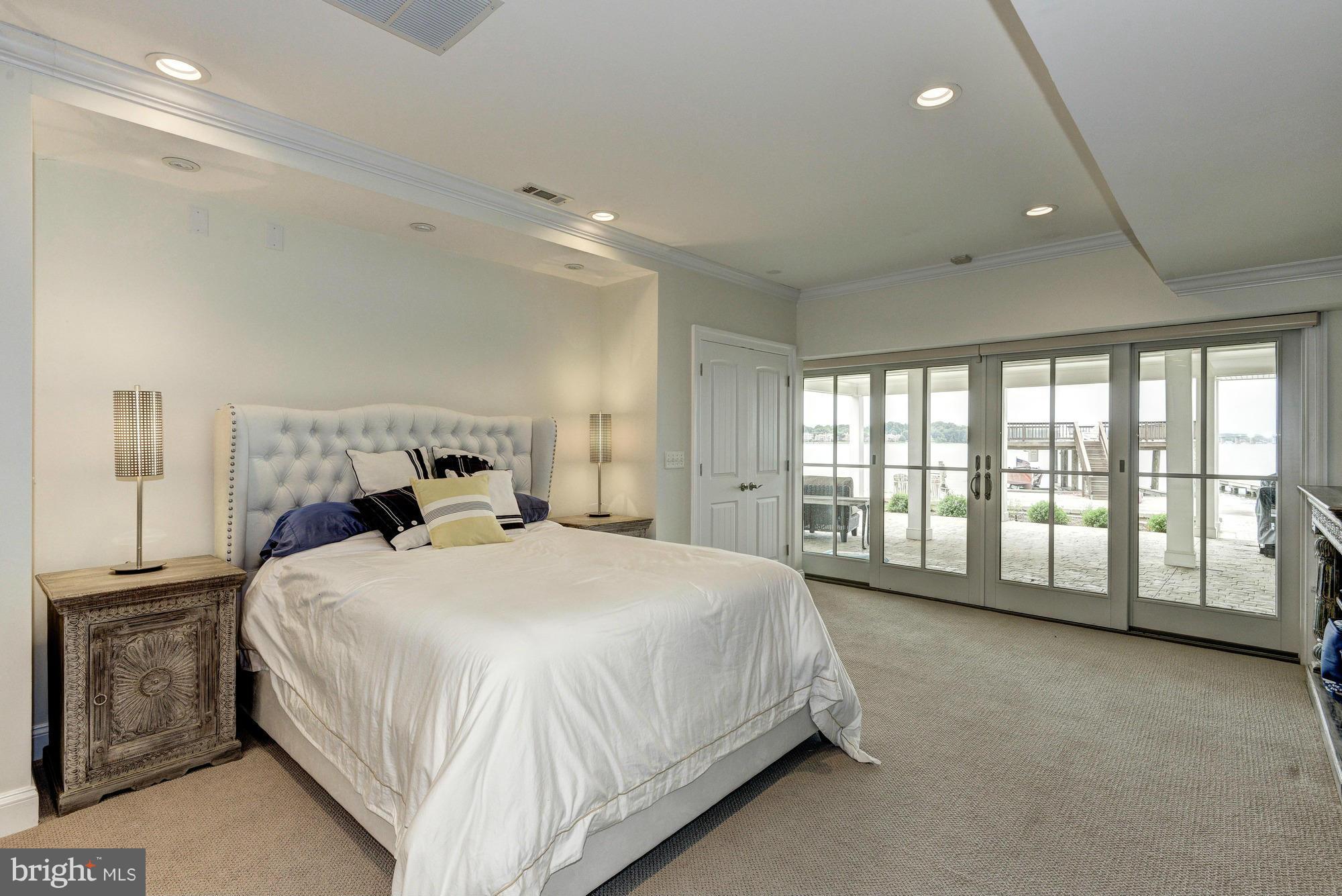 532 Sunset Road Annapolis, MD 21403 - Photo 20 of 30 a spacious bedroom with a bed and a large window