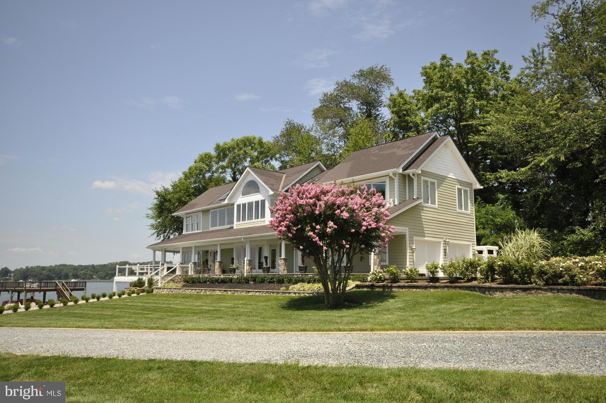 532 Sunset Road Annapolis, MD 21403 - Photo 3 of 30 a front view of a house with a garden and trees