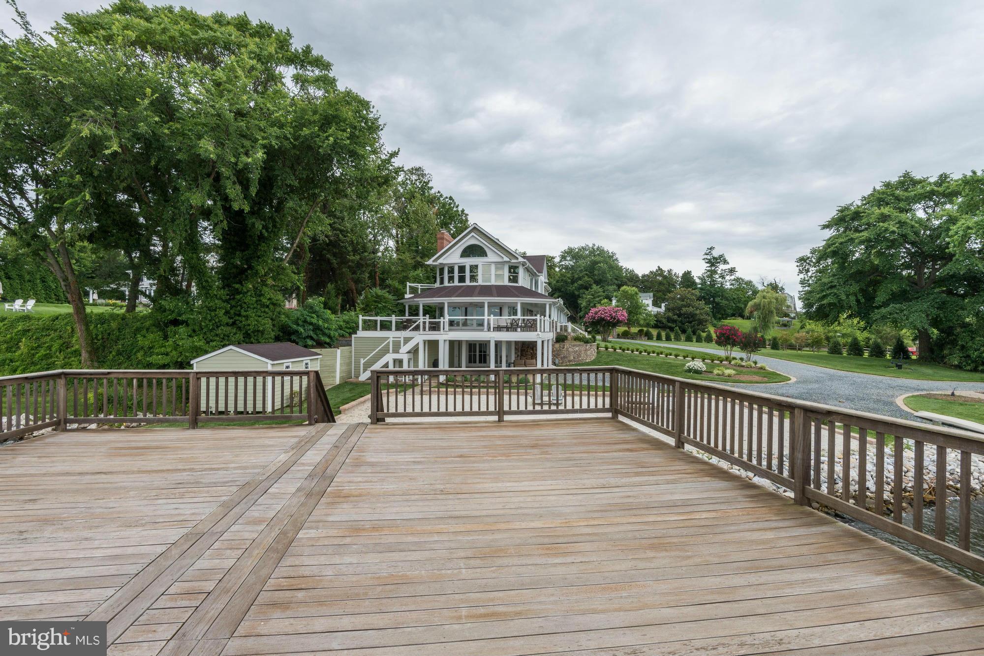 532 Sunset Road Annapolis, MD 21403 - Photo 23 of 30 a view of a balcony with wooden floor and fence