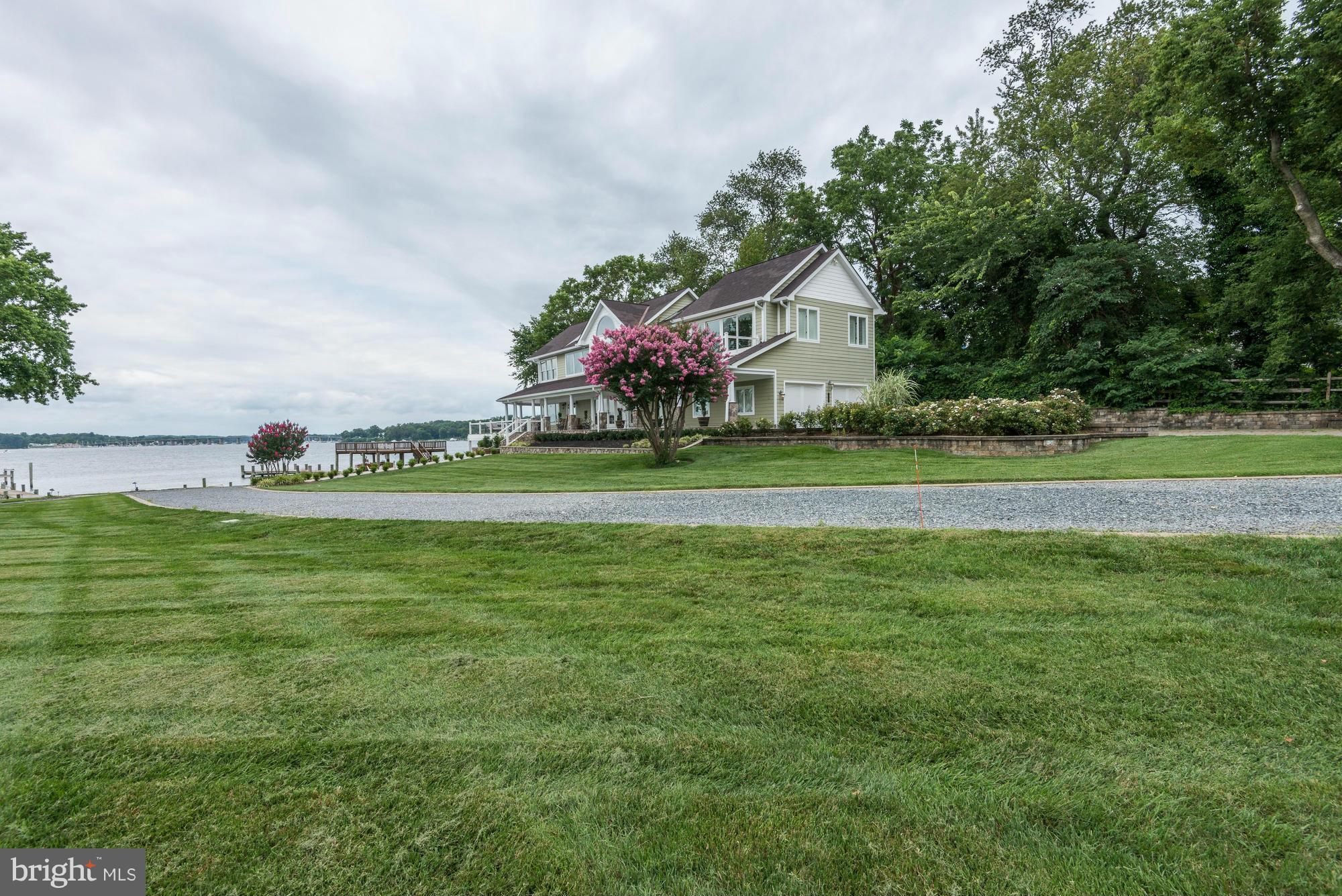 532 Sunset Road Annapolis, MD 21403 - Photo 4 of 30 a front view of a house with a garden and trees