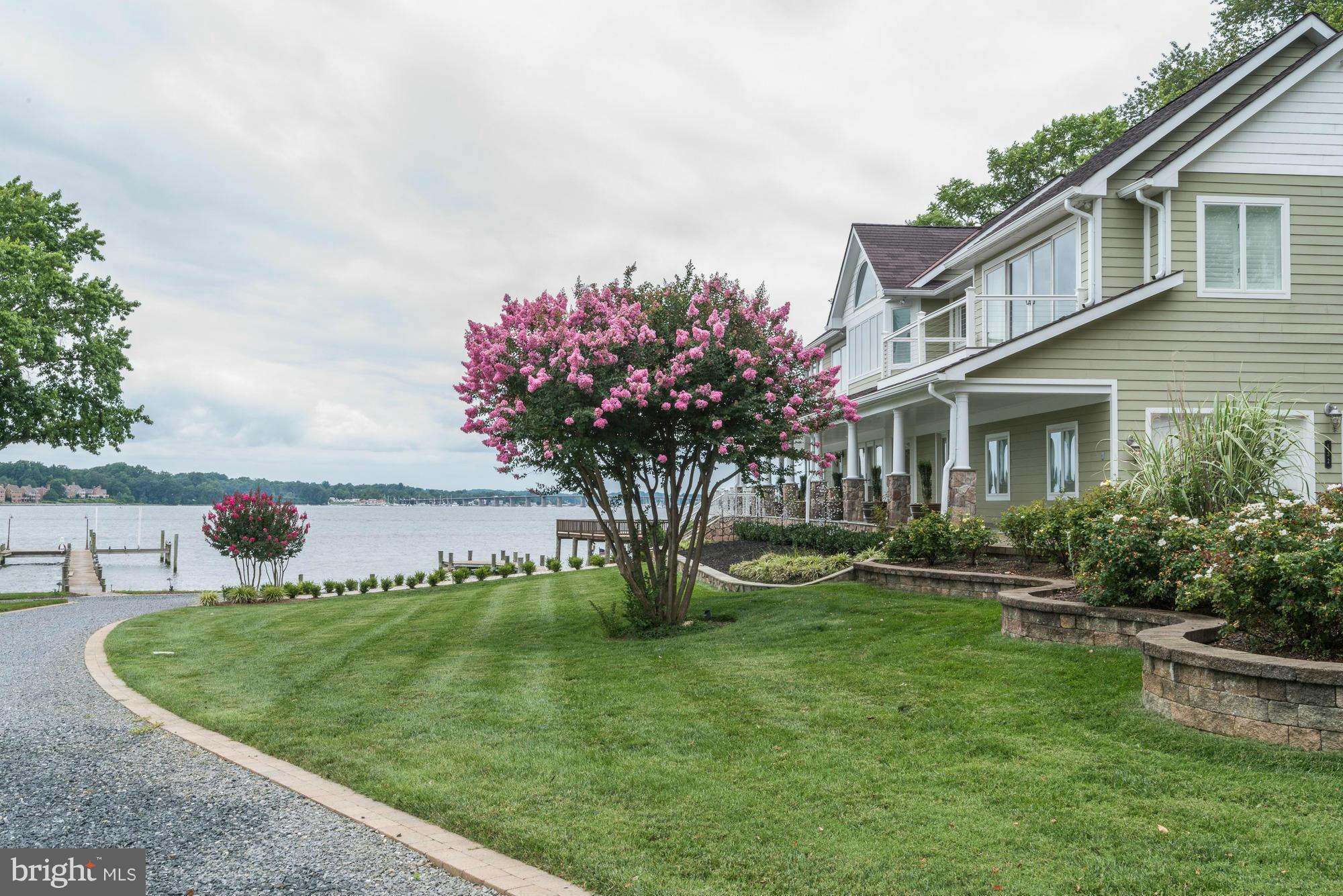 532 Sunset Road Annapolis, MD 21403 - Photo 5 of 30 a view of a house with a big yard potted plants and large tree