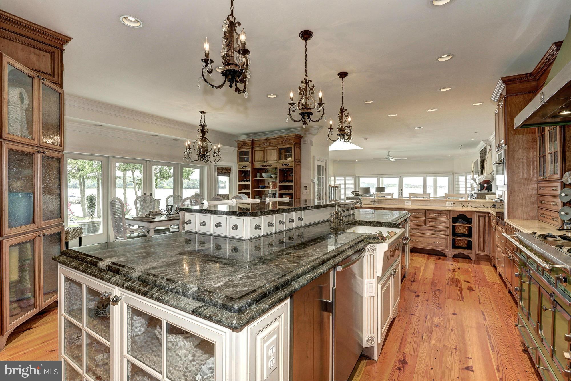 532 Sunset Road Annapolis, MD 21403 - Photo 6 of 30 a kitchen with stainless steel appliances granite countertop a sink a stove and a wooden floors