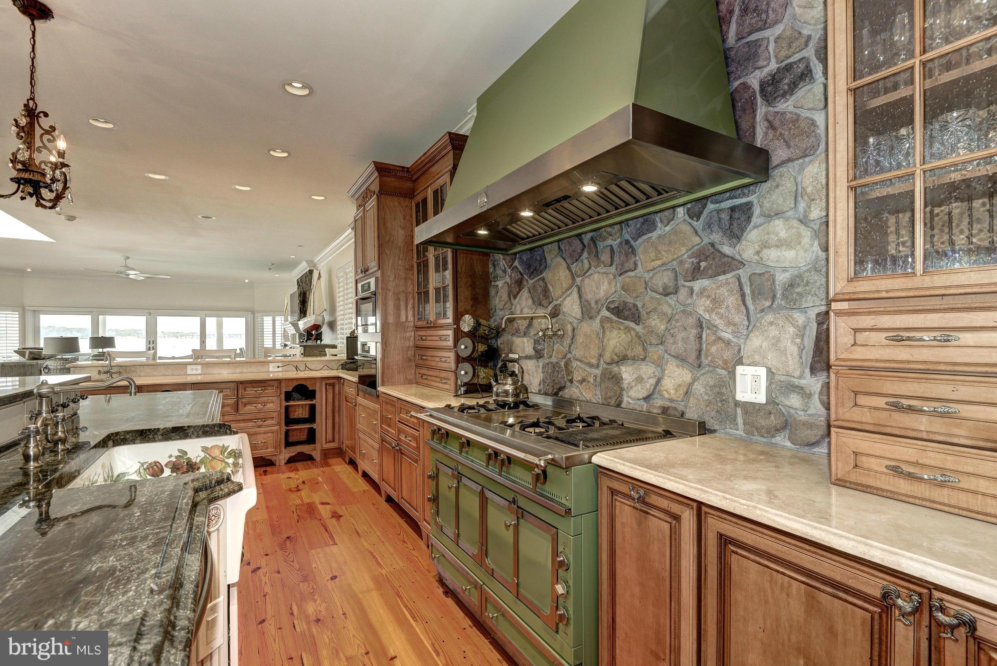 532 Sunset Road Annapolis, MD 21403 - Photo 7 of 30 a kitchen with stainless steel appliances granite countertop a stove and a refrigerator