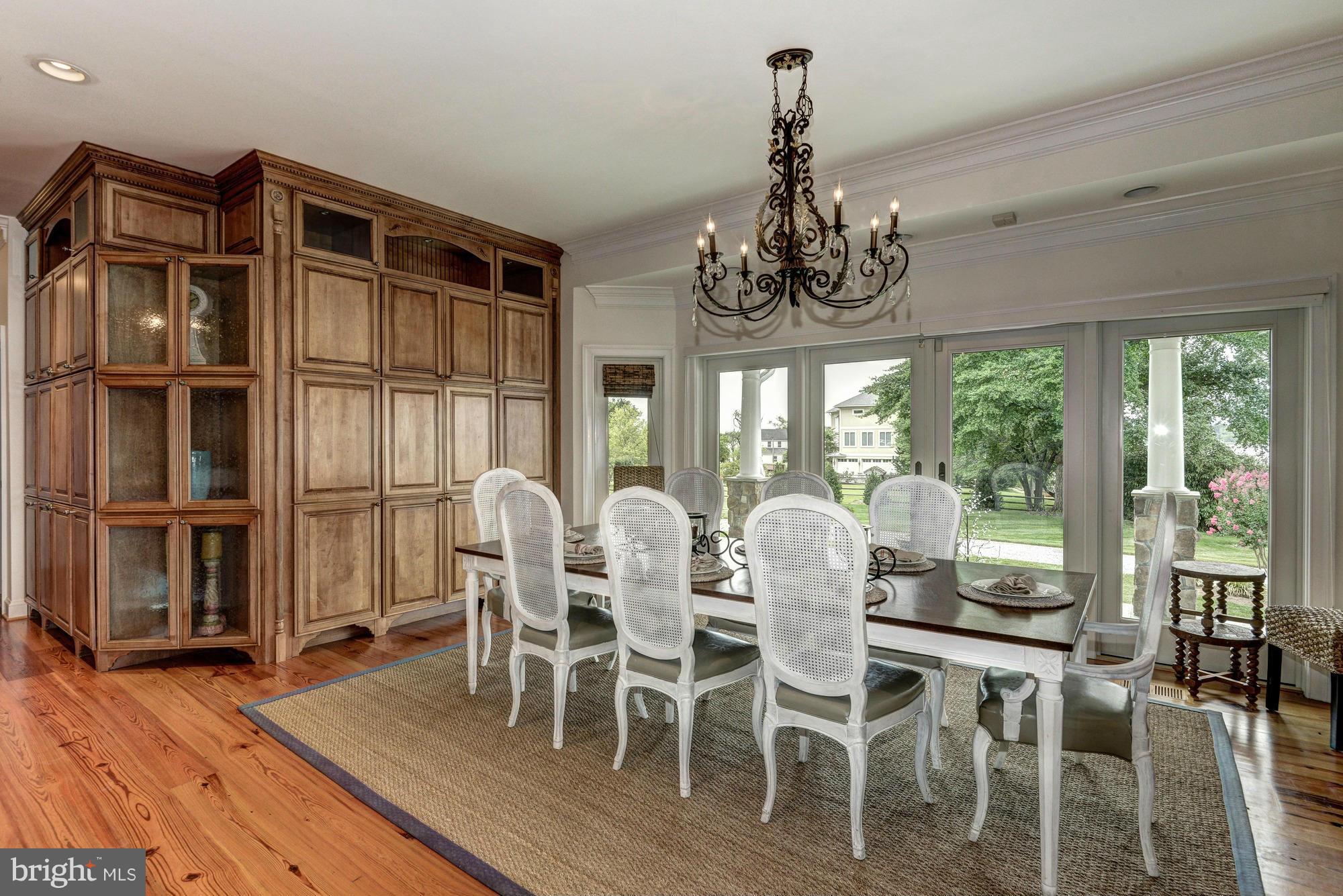 532 Sunset Road Annapolis, MD 21403 - Photo 8 of 30 a view of a dining room with furniture window and wooden floor