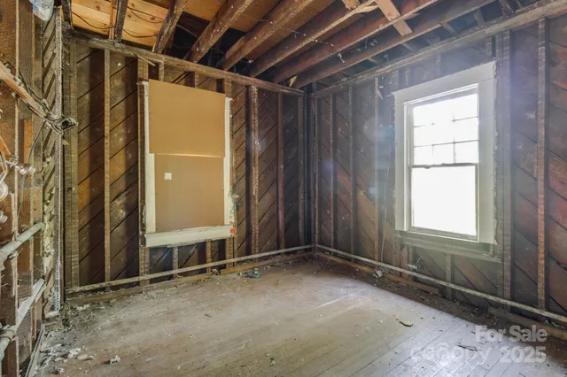 a view of a room with wooden walls