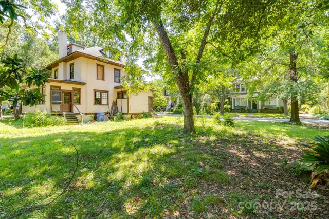a view of a yard with swimming pool
