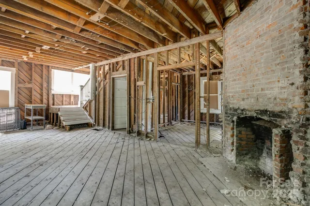 a view of outdoor space with wooden floor and seating