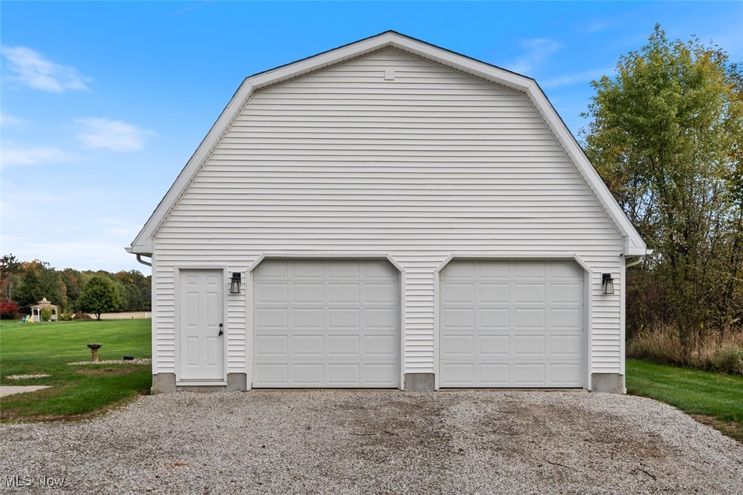 891 Station Road Valley City, OH 44280 - Photo 37 of 45 Garage with a lawn