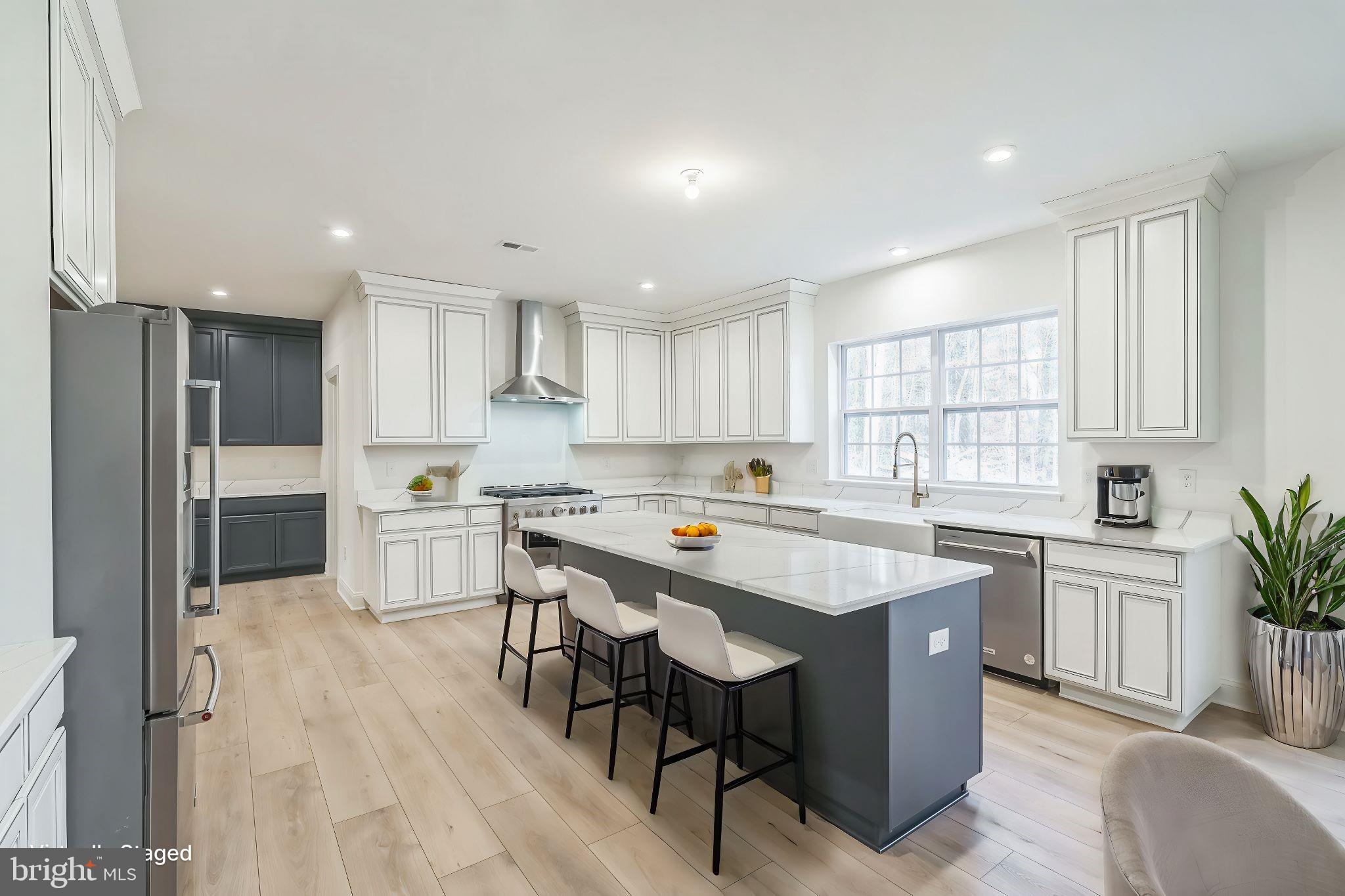 35 Barbertown Point Breeze Road Frenchtown, NJ 08825 - Photo 12 of 43 a kitchen with a sink a center island stainless steel appliances and cabinets