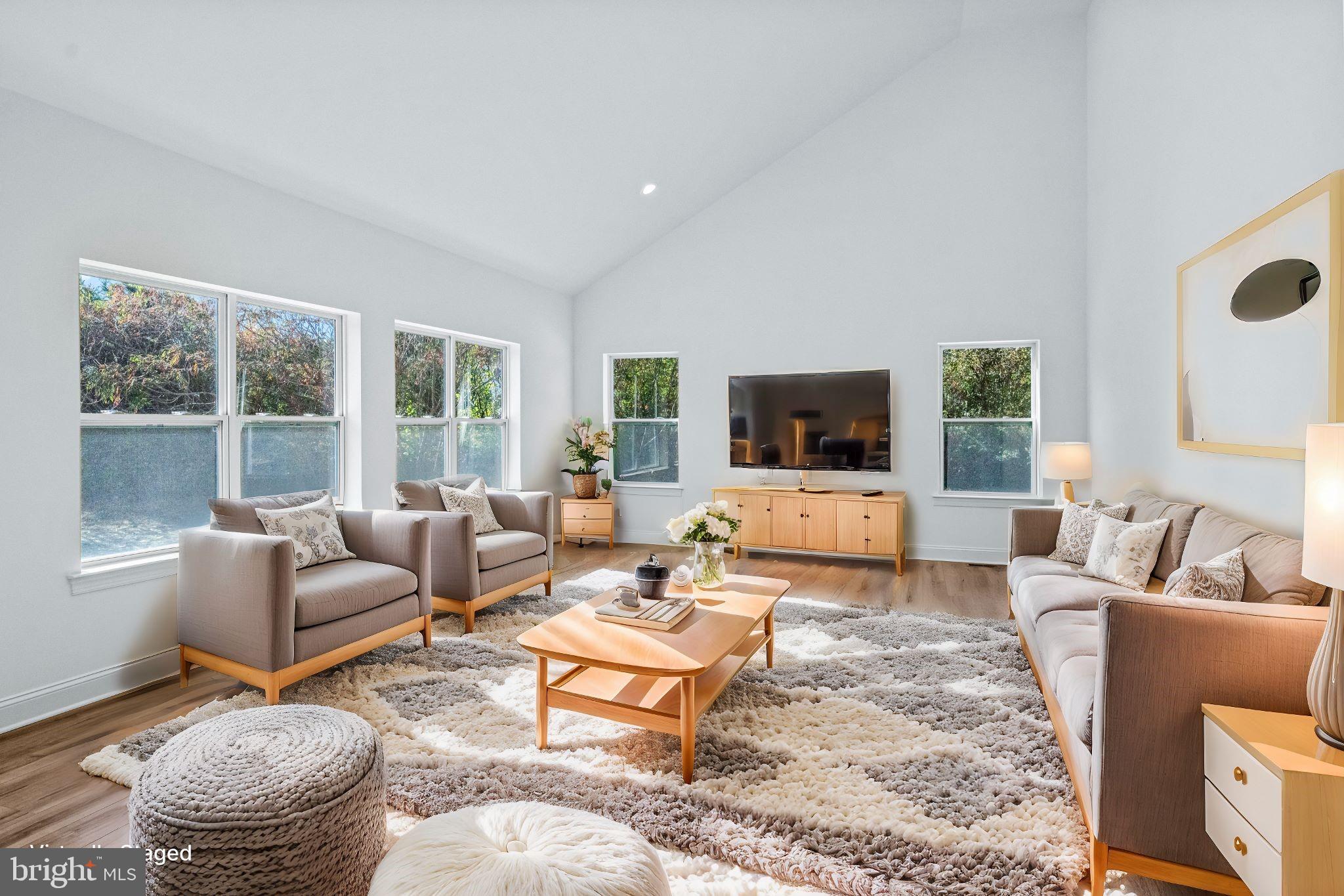 35 Barbertown Point Breeze Road Frenchtown, NJ 08825 - Photo 19 of 43 a living room with furniture and a flat screen tv