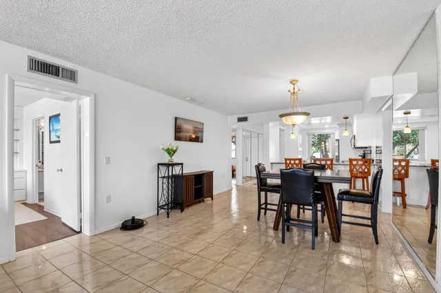 a kitchen with stainless steel appliances a stove microwave and sink
