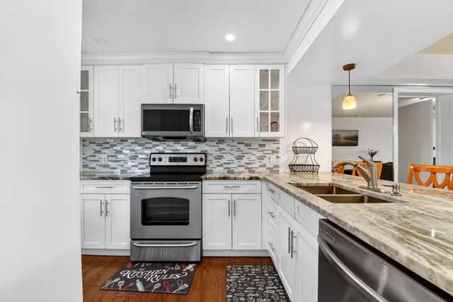 a view of a dining room with furniture and window