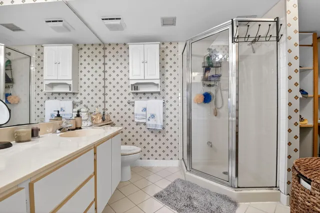 a view of a lake with houses in the background