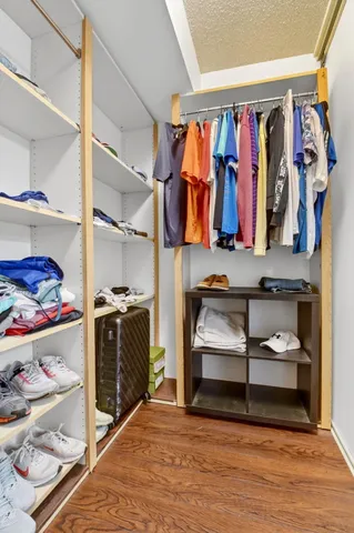 a view of an apartment with a deck and a large window