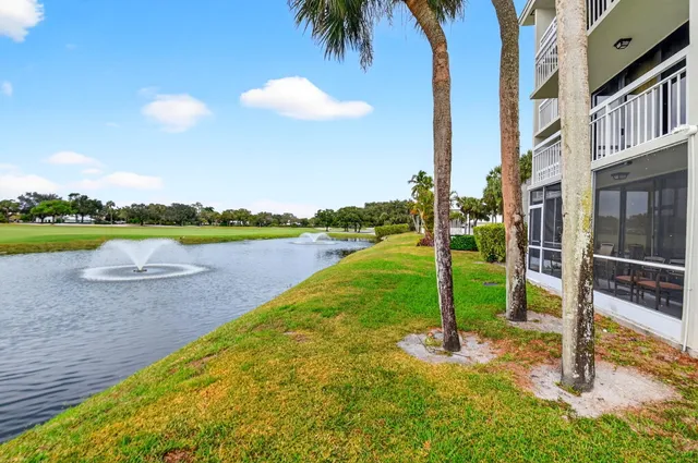 a bathroom with a double vanity sink mirror and toilet