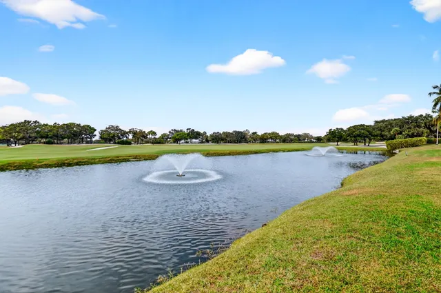 a bedroom with a bed dresser and a window