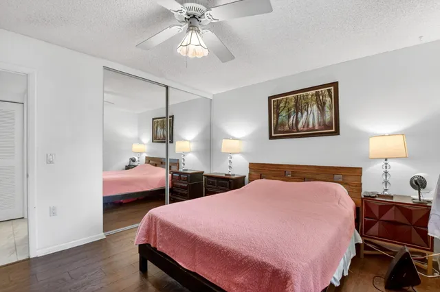 a swimming pool with outdoor seating and plants