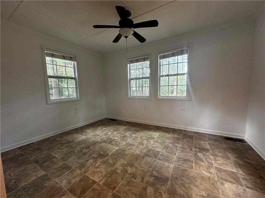 2536 Country Lake Circle Powder Springs, GA 30127 - Photo 11 of 25 a view of an empty room and window