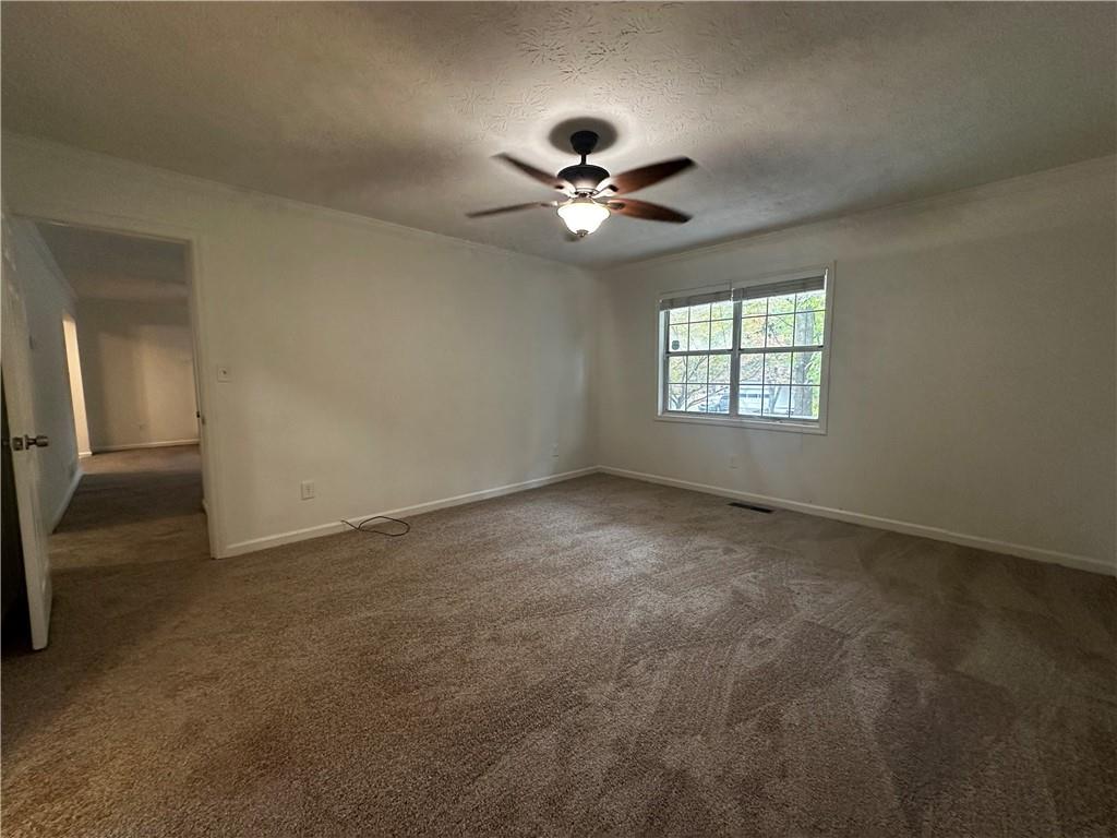 2536 Country Lake Circle Powder Springs, GA 30127 - Photo 14 of 25 a view of an empty room with a window