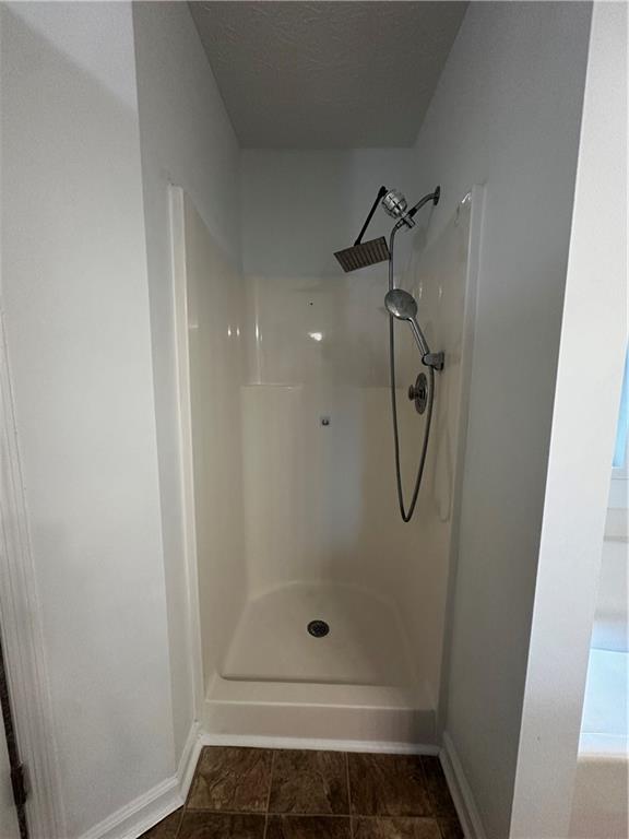 2536 Country Lake Circle Powder Springs, GA 30127 - Photo 16 of 25 a bathroom with a glass shower door