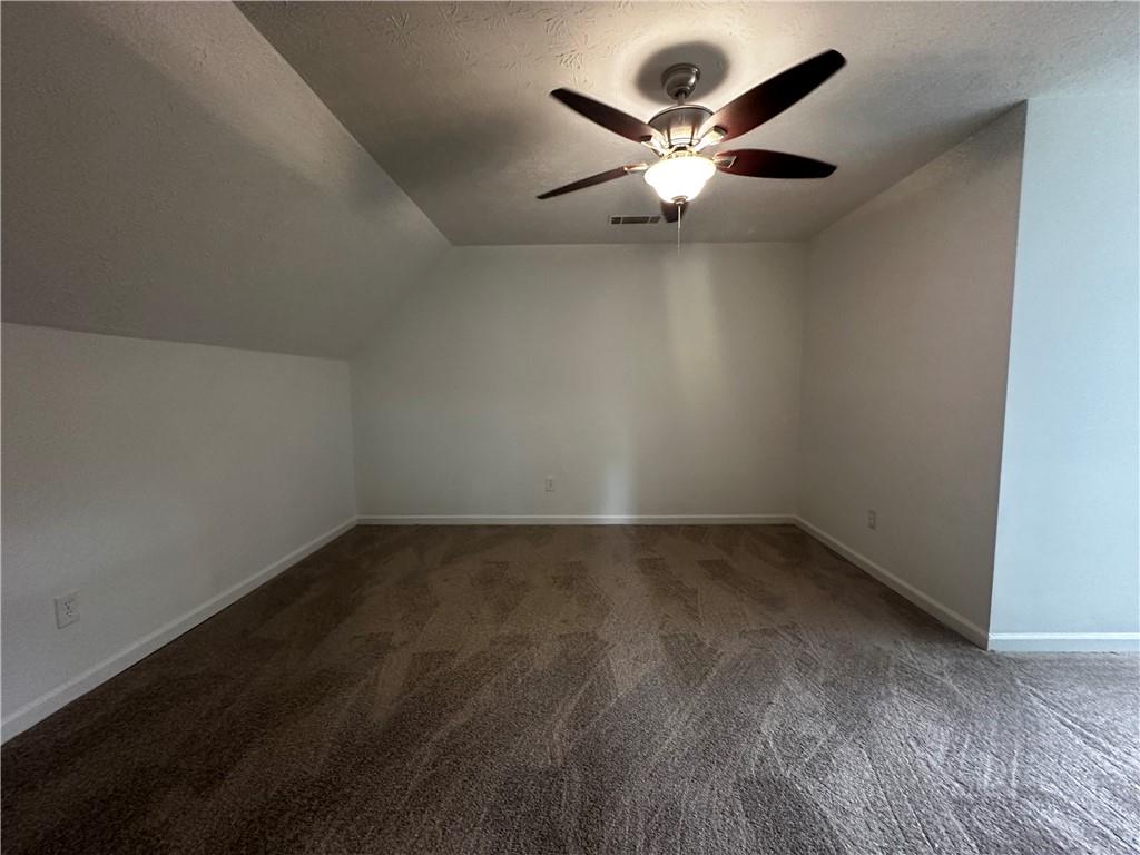 2536 Country Lake Circle Powder Springs, GA 30127 - Photo 22 of 25 a view of an empty room with wooden floor