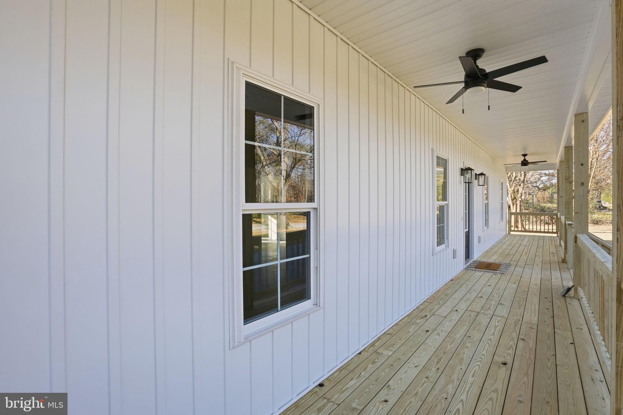 475 Fredericks Hall Road Bumpass, VA 23024 - Photo 12 of 44 a view of a hallway with wooden floor and entryway