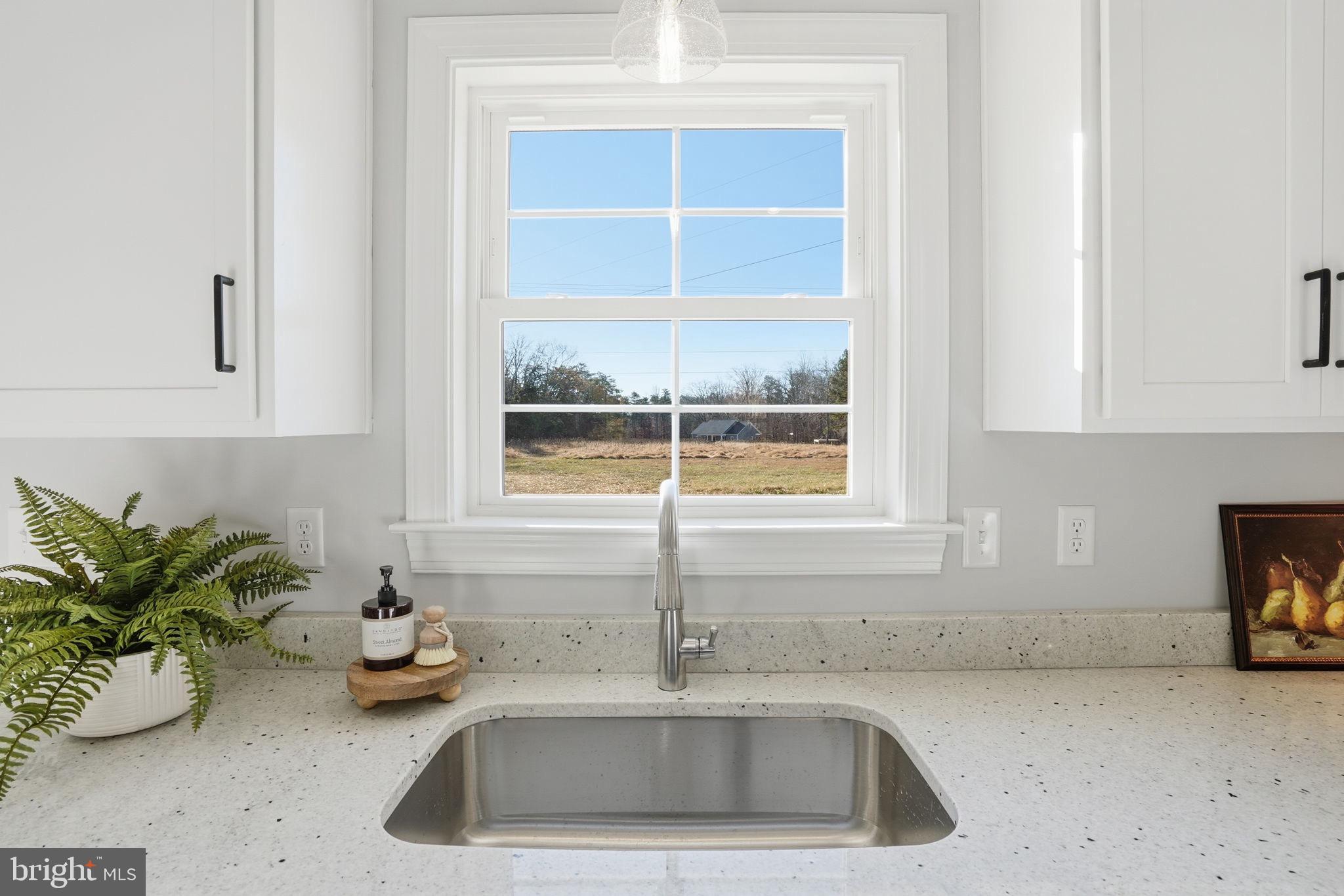 475 Fredericks Hall Road Bumpass, VA 23024 - Photo 17 of 44 a kitchen with a sink and window