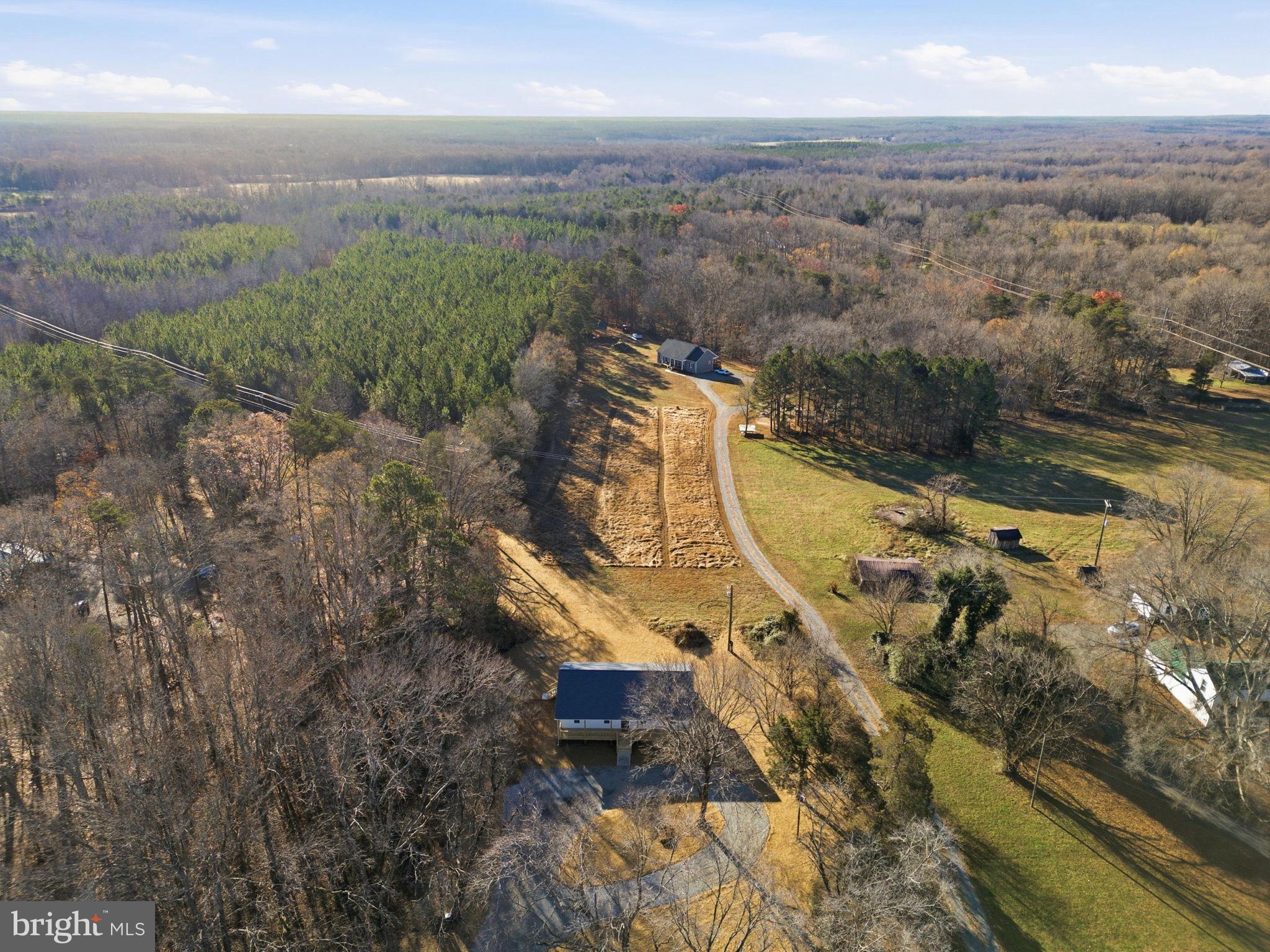 475 Fredericks Hall Road Bumpass, VA 23024 - Photo 2 of 44 an aerial view of a residential houses with outdoor space