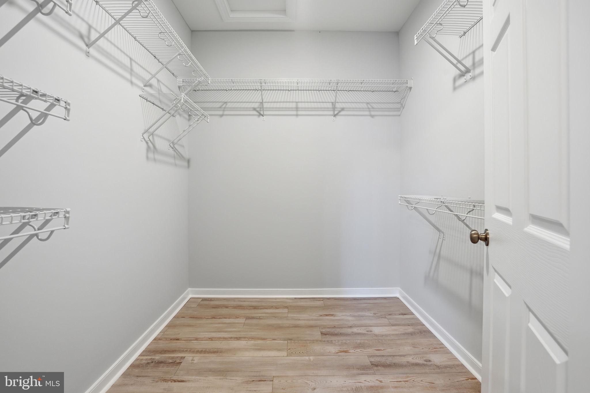 475 Fredericks Hall Road Bumpass, VA 23024 - Photo 22 of 44 a view of a room with racks on the wall