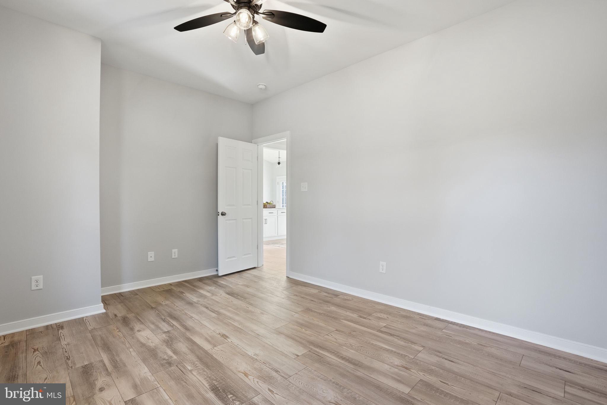 475 Fredericks Hall Road Bumpass, VA 23024 - Photo 28 of 44 wooden floor in an empty room